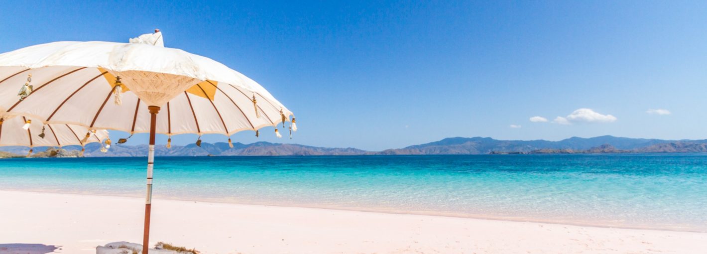 Beach umbrella and white sand