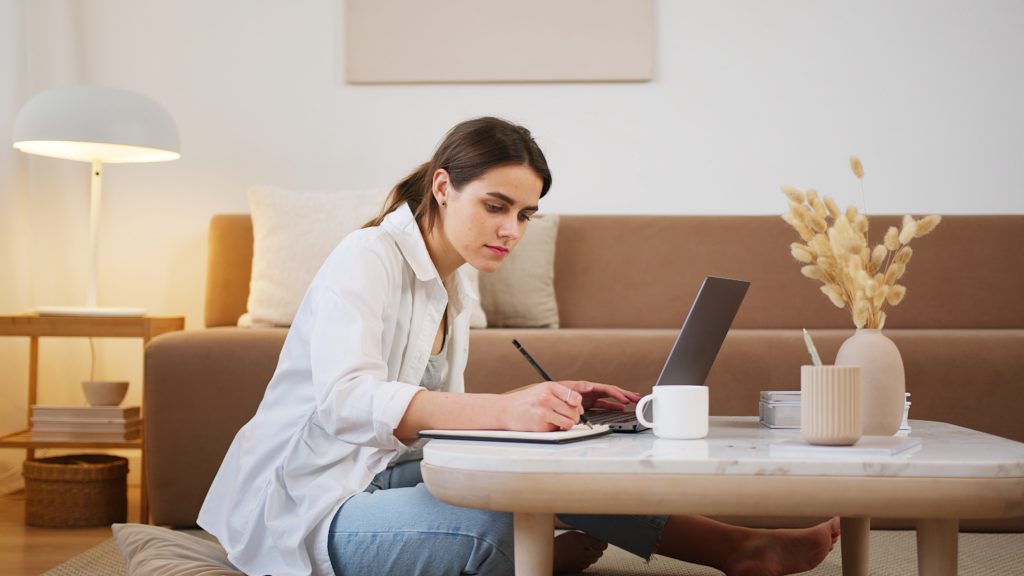 Student studying at home in their living room